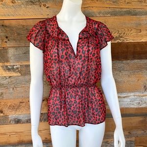 Red animal print sheer peplum top